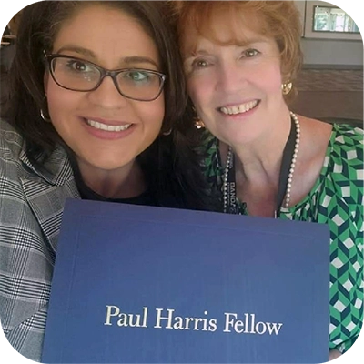 Lucy Escobar receiving Paul Harris Fellowship