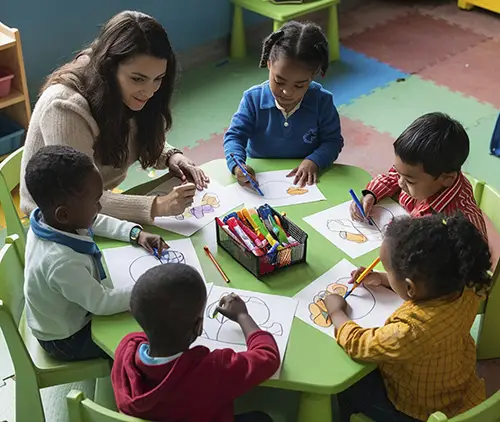 Teacher with 4 students at table