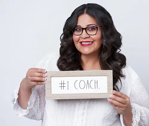 Lucy holding #1 Coach sign