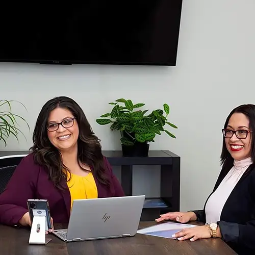 Lucy and another woman in meeting
