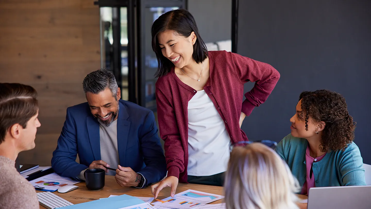 Business leaders reviewing data and discussing organizational strategy during a strategic planning meeting