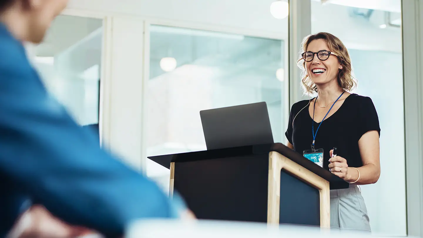 Woman presenting during a leadership training session for women leaders and emerging female executives